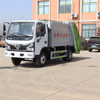 Rear loading and unloading compressed garbage truck